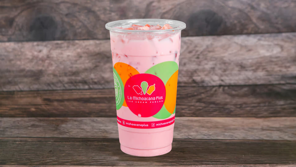 Glass of refreshing agua fresca made with fruit and ice