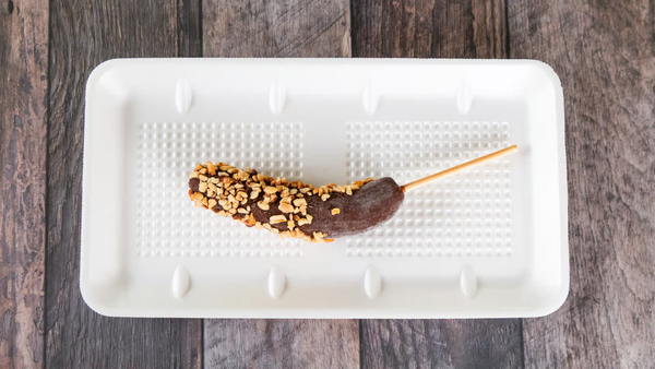 Banana dipped in our classic chocolate recipe and your favorite topping!