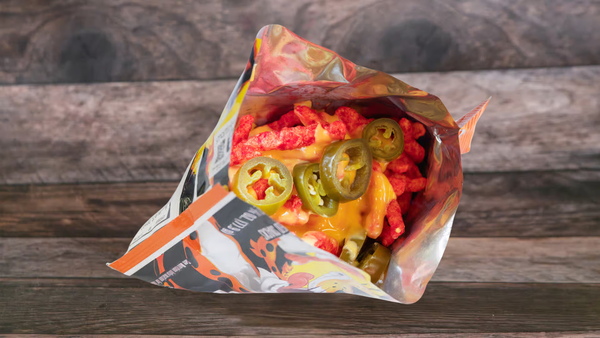 Hot Cheetos the Michoacana way! Served with melted creamy cheese and jalapeños.