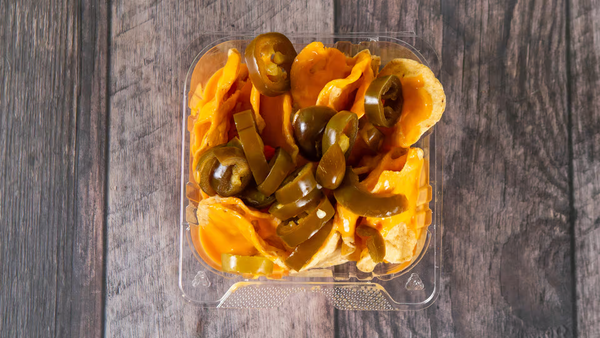 Nachos served with creamy melted cheese and mild jalapeños!